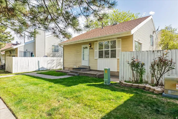 View of front of property featuring a shingled roof