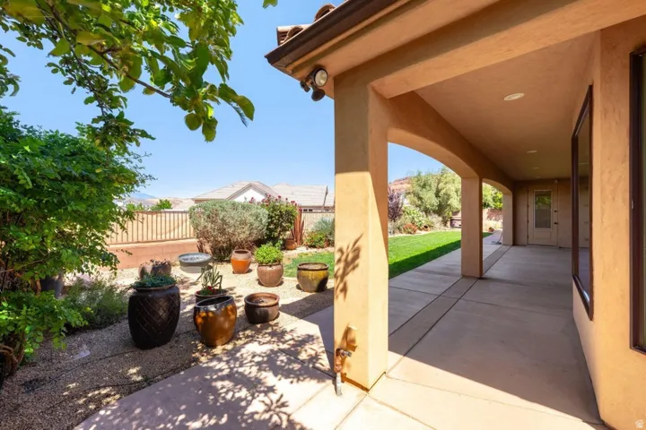 Fenced backyard with a patio area