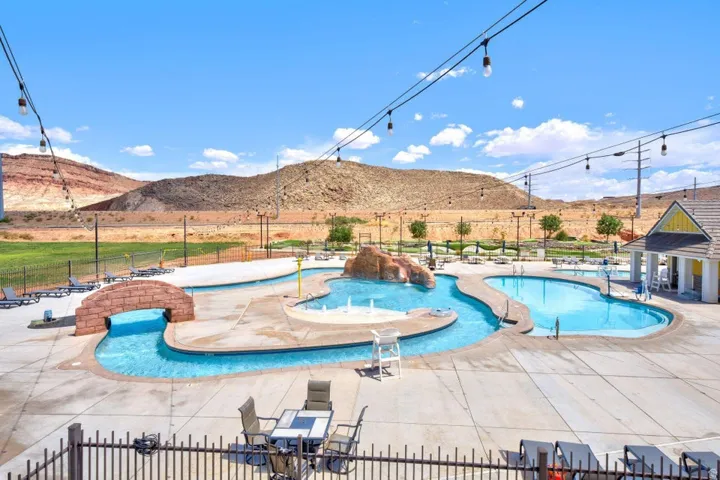 Community pool featuring a patio area and a mountain view