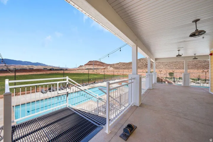 View of swimming pool with a mountain view and patio surround