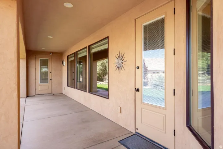 Property entrance featuring a patio and stucco siding