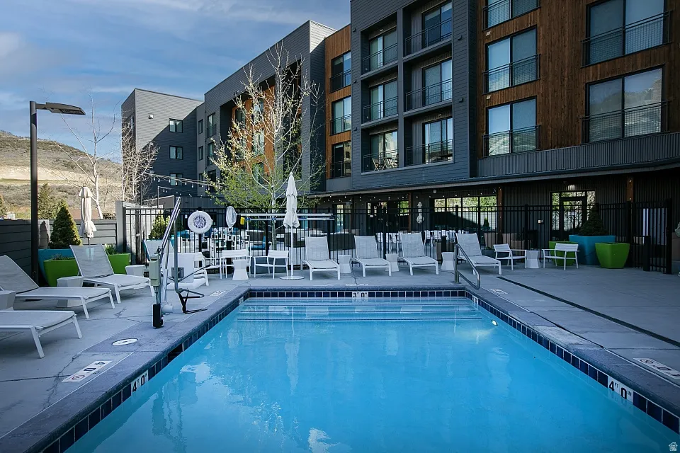 Community pool featuring a patio area