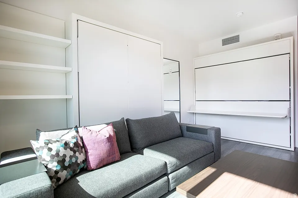 Home theater room with wood finished floors