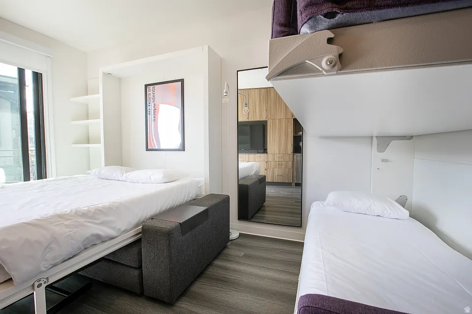 Bedroom featuring dark wood-style flooring