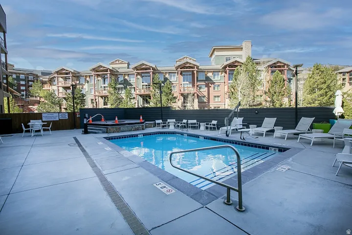 Community pool featuring a patio