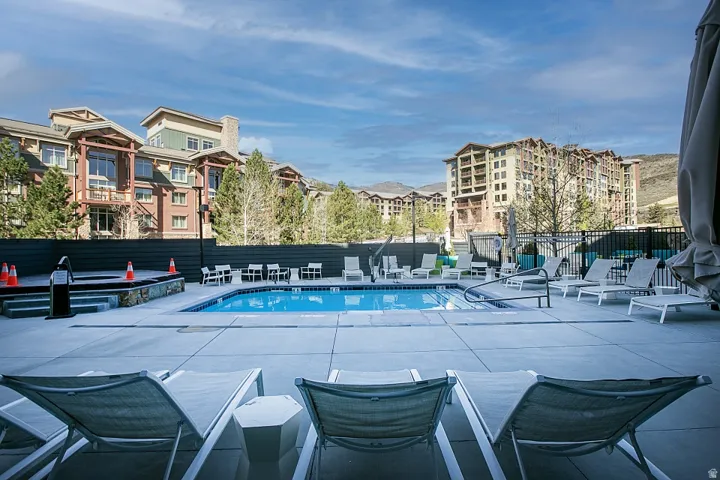 Community pool featuring a patio