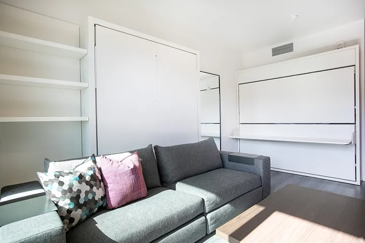 Home theater room with wood finished floors