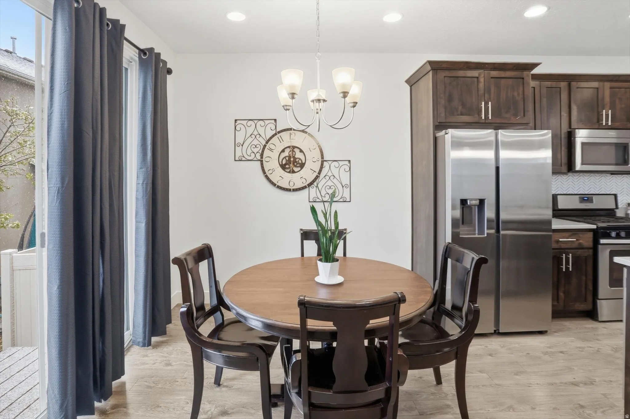 Dining area featuring a chandelier and light wood-style floors