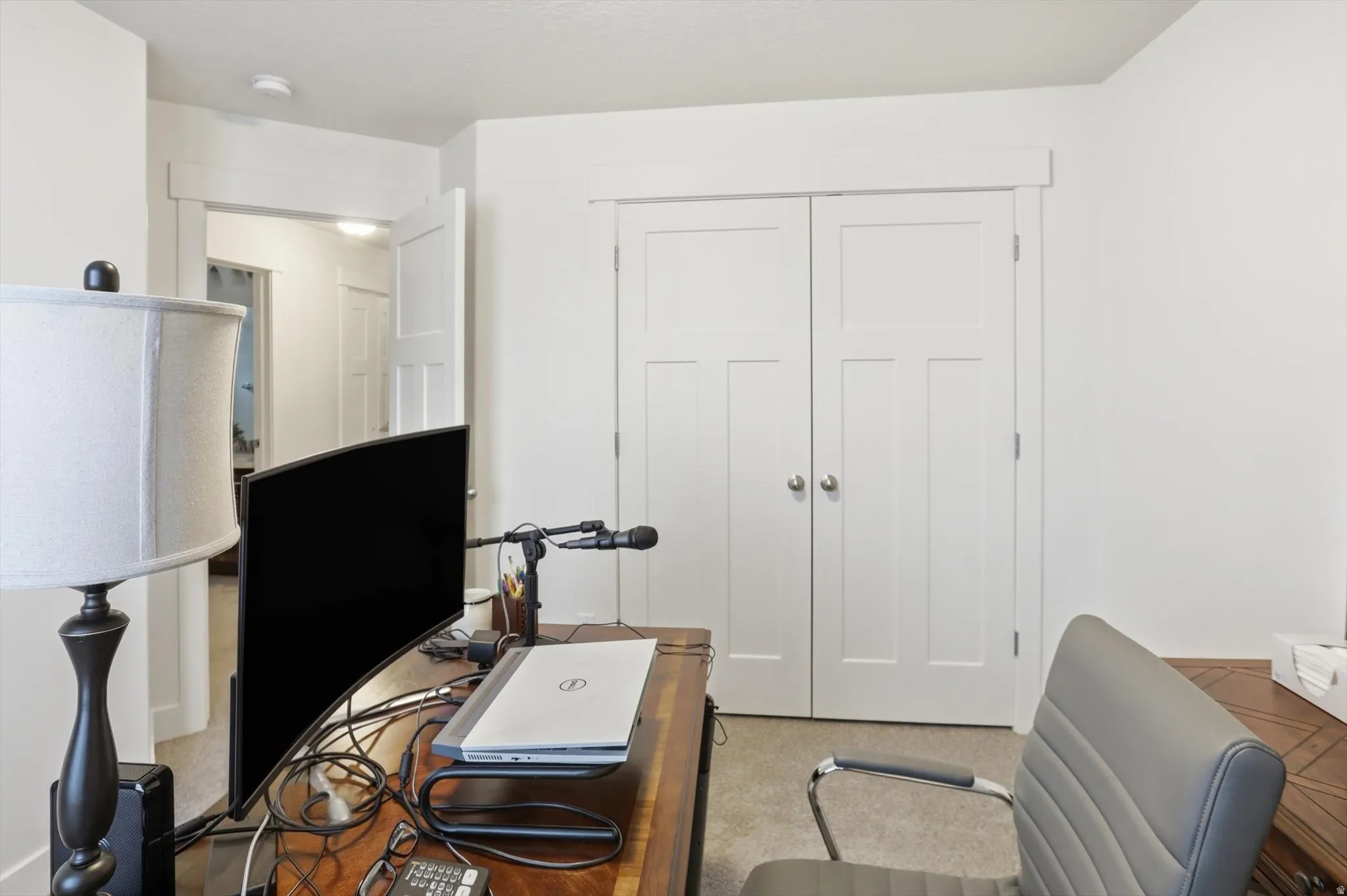 Office featuring light carpet