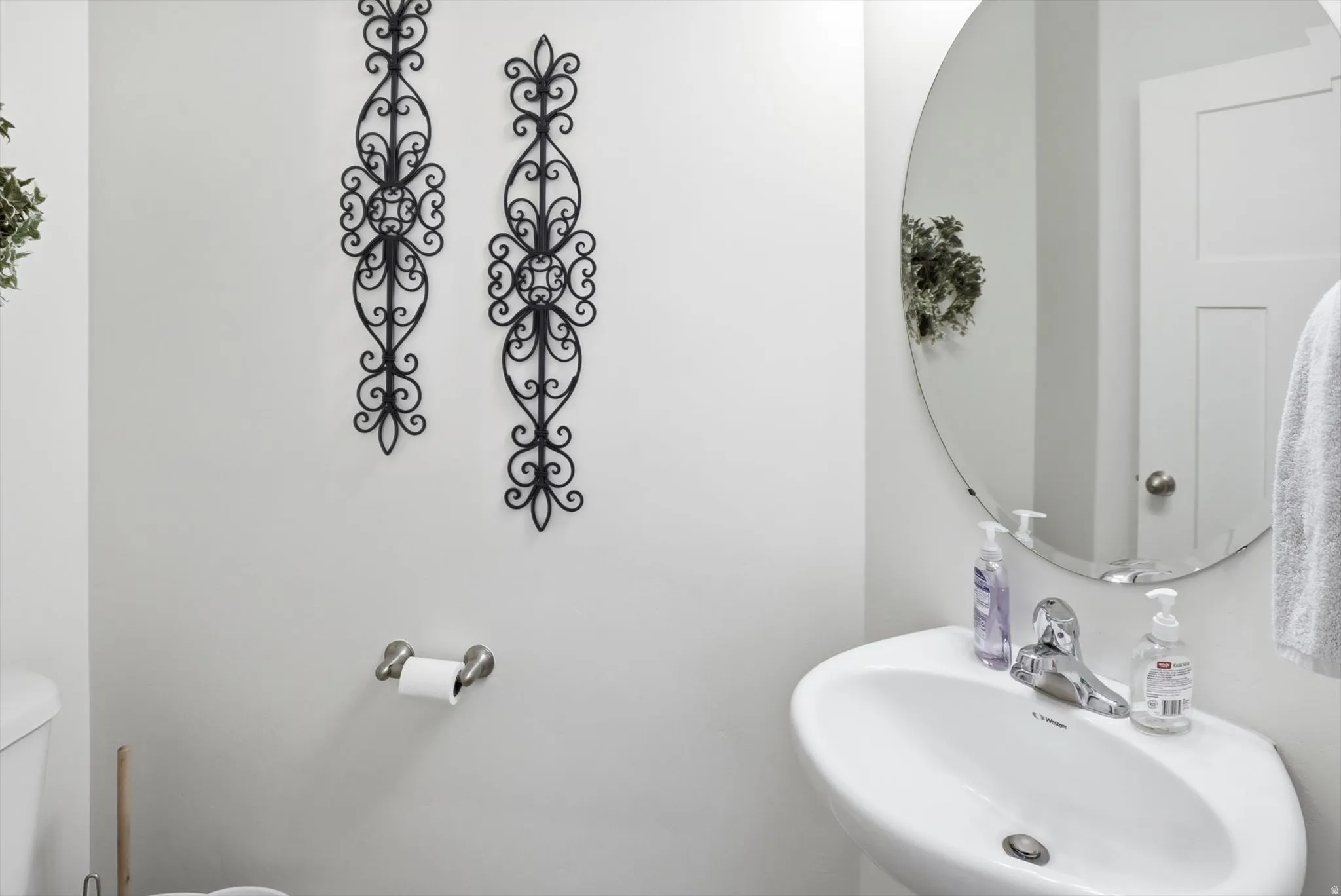 Half bath featuring a sink and toilet