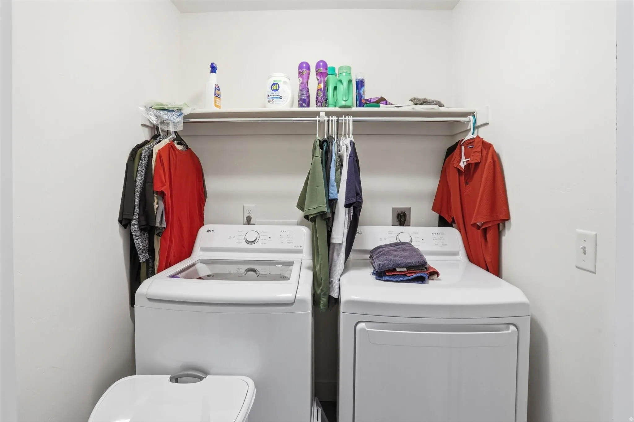 Laundry area with washing machine and clothes dryer