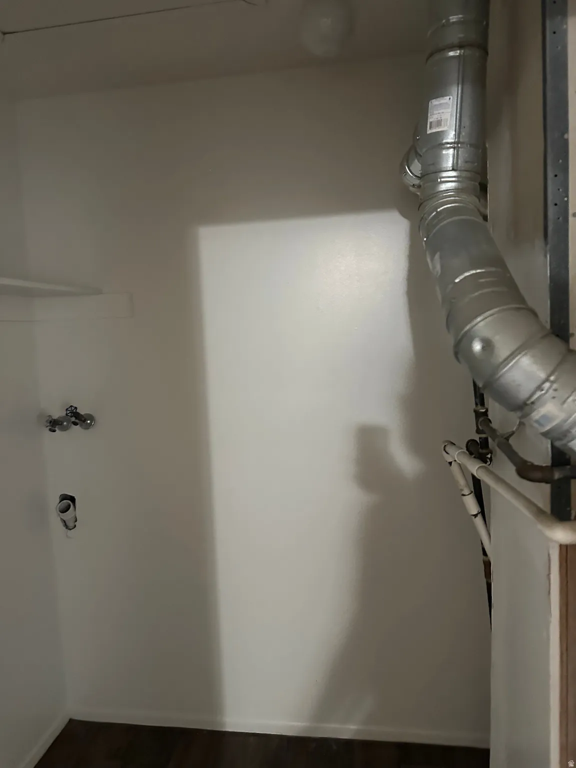 Detailed view of baseboards and wood finished floors