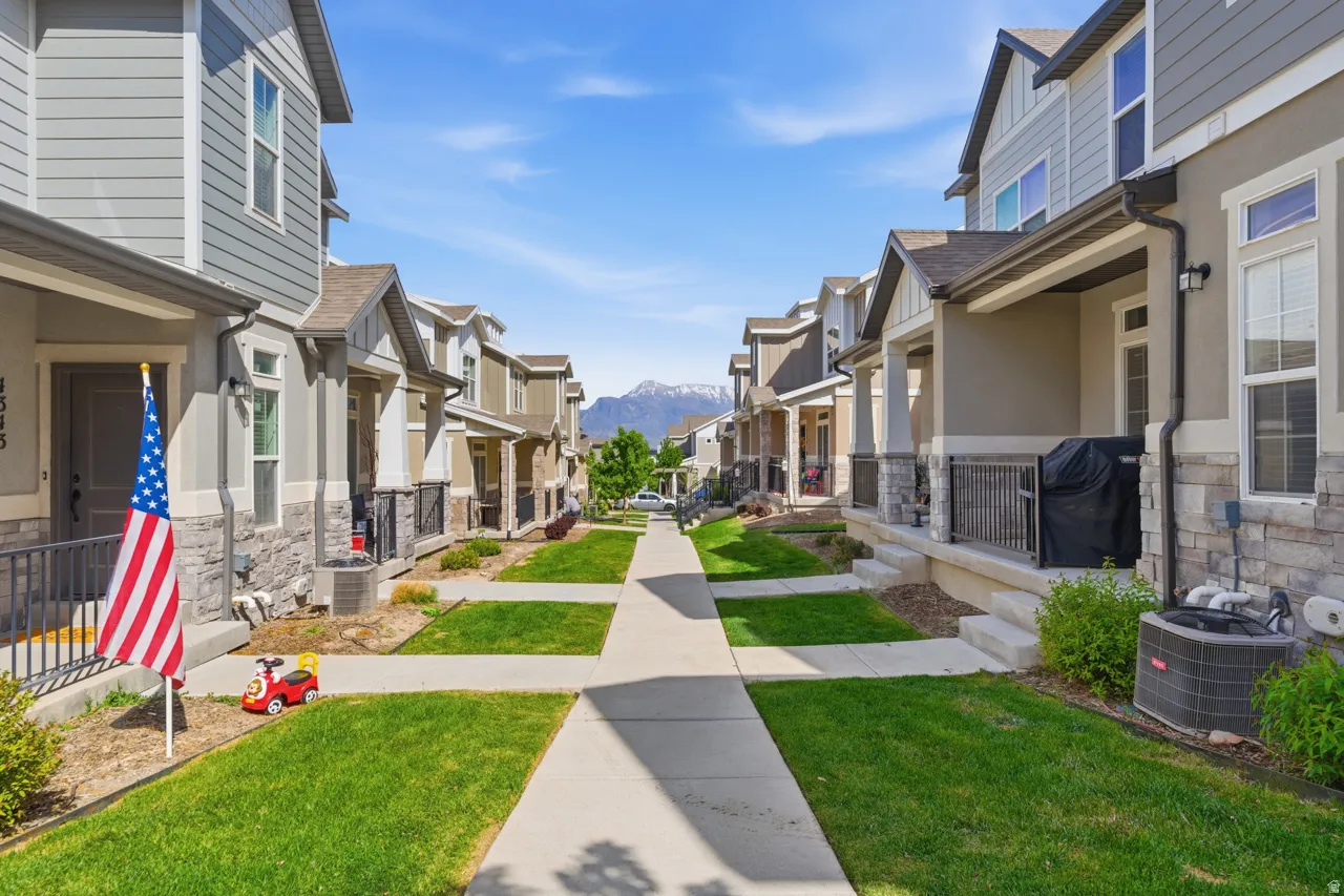 Surrounding community featuring a residential view, a mountain view, and covered porch