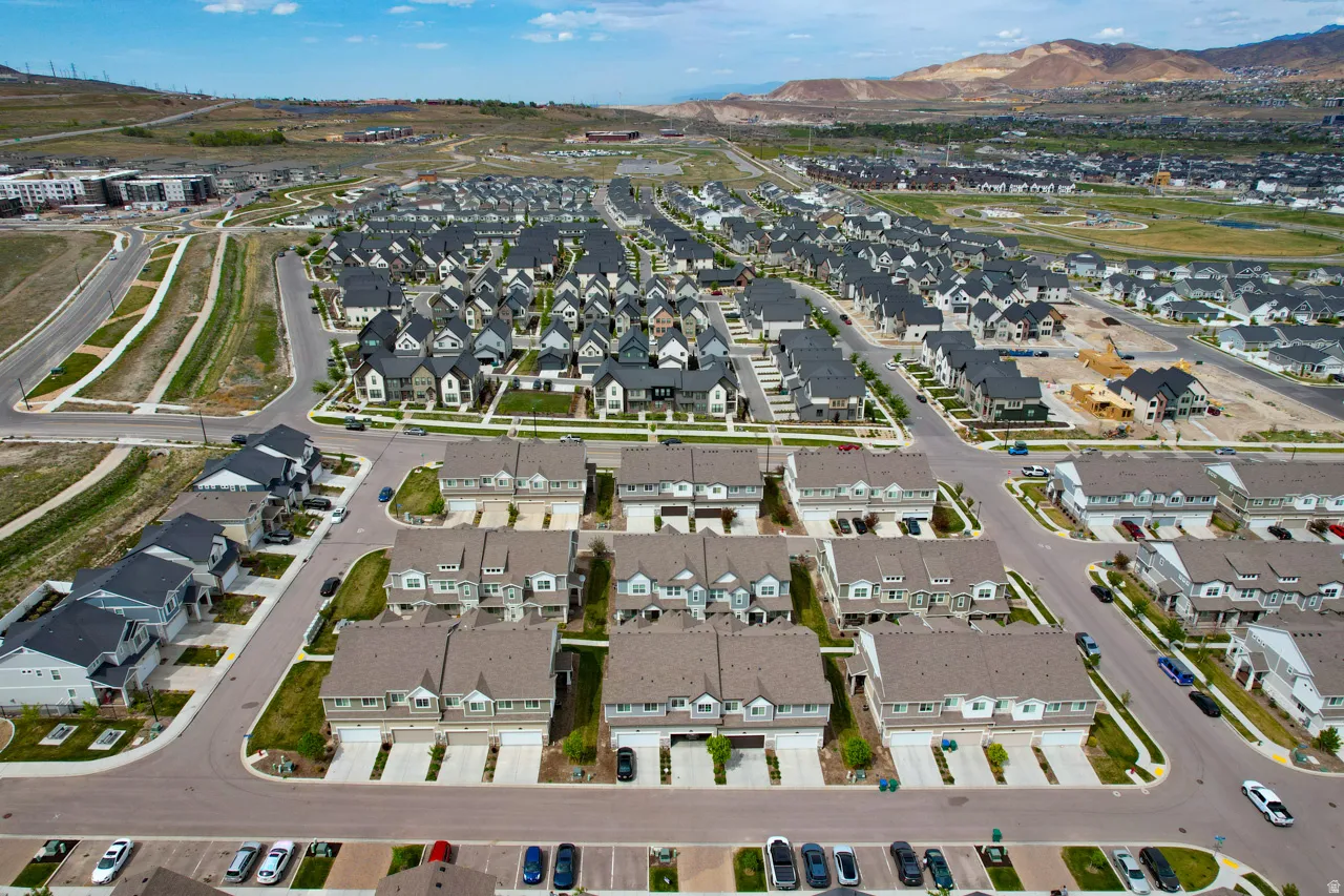 Aerial view of property's location featuring nearby suburban area