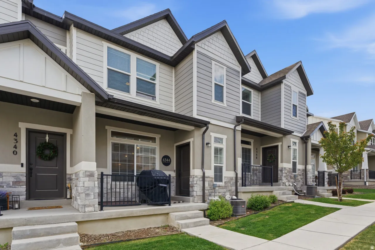 Craftsman house featuring stone siding and covered porch