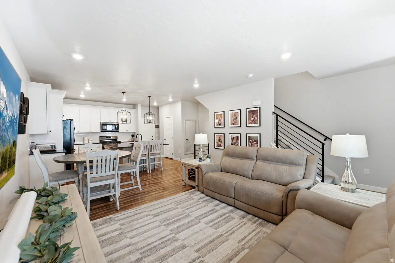 Living room featuring light wood-style floors and recessed lighting
