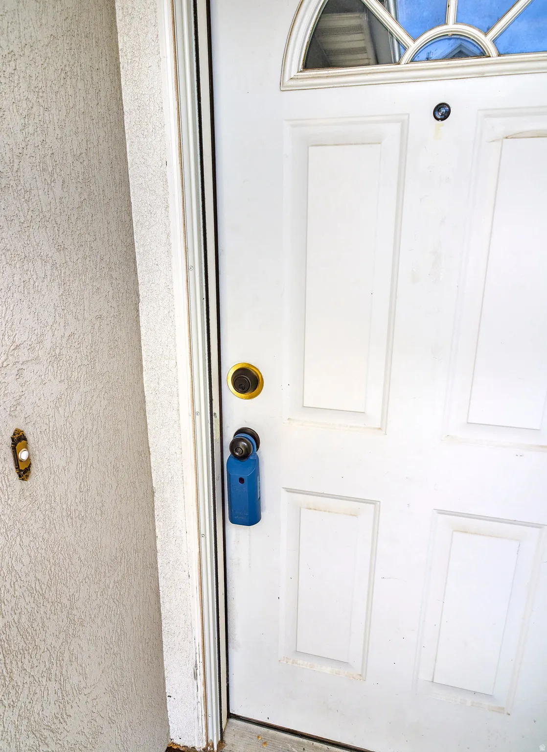 View of exterior entry with stucco siding