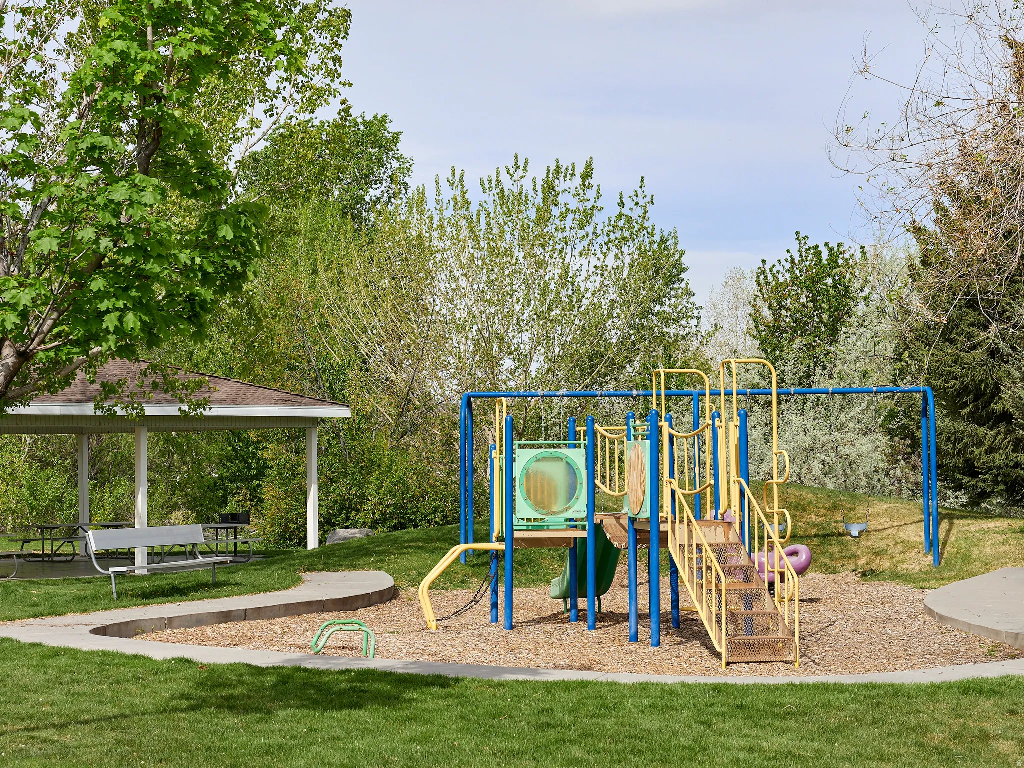 Community jungle gym with a yard