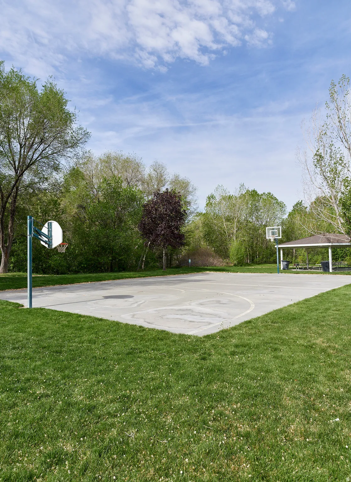 View of sport court with a lawn and community basketball court