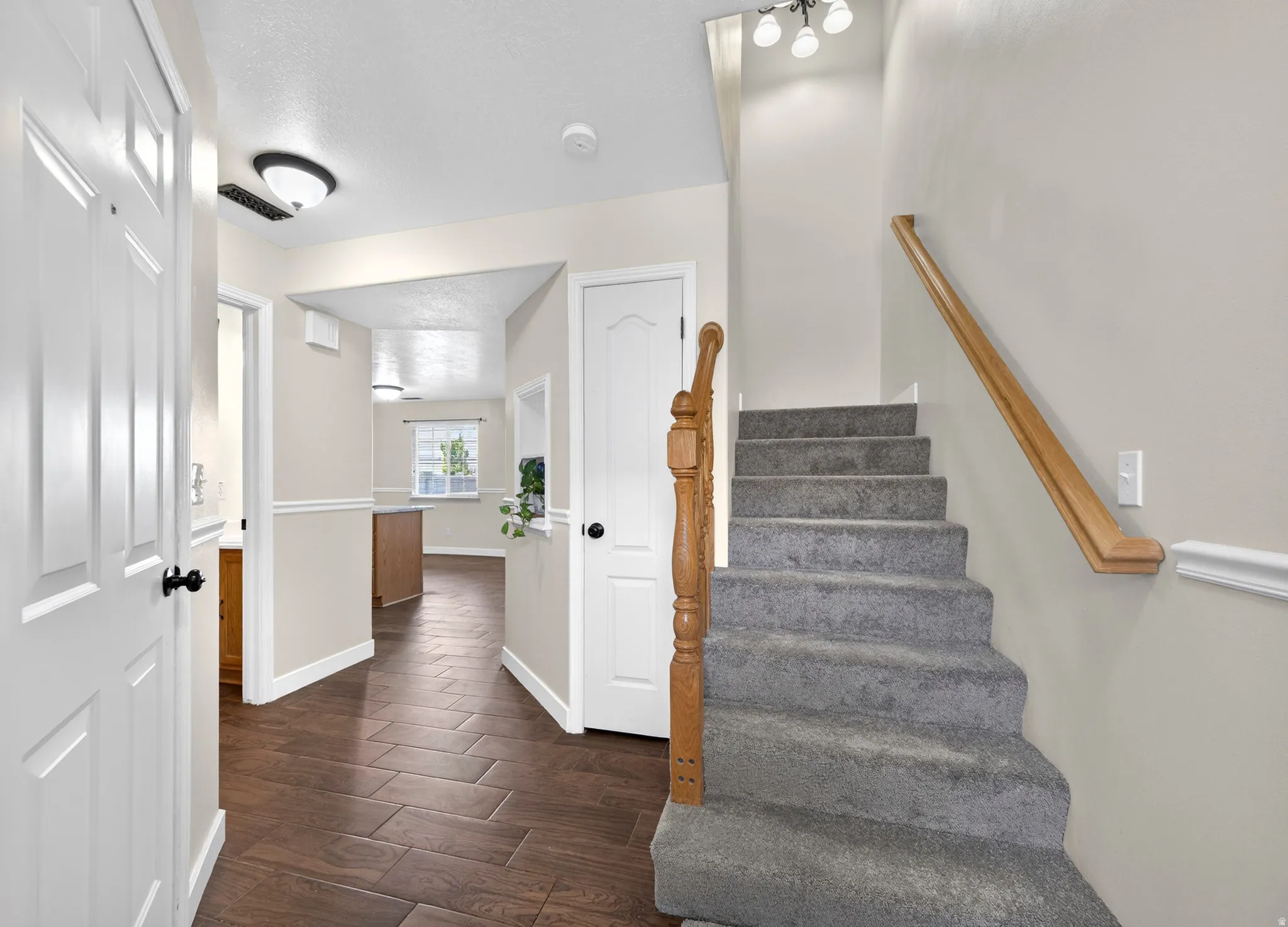 Staircase featuring wood finished floors and baseboards