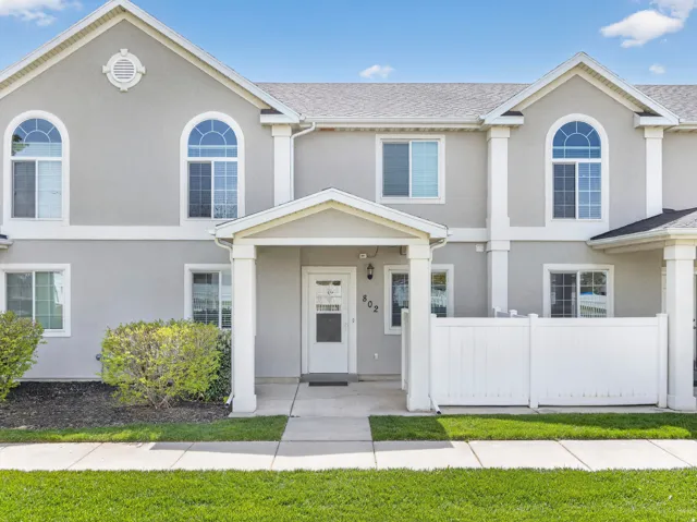View of front facade featuring stucco siding