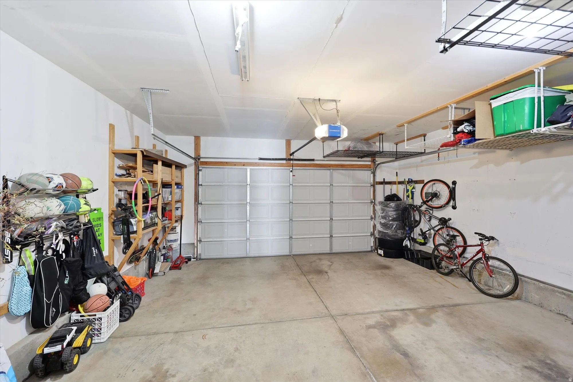 Garage featuring a garage door opener