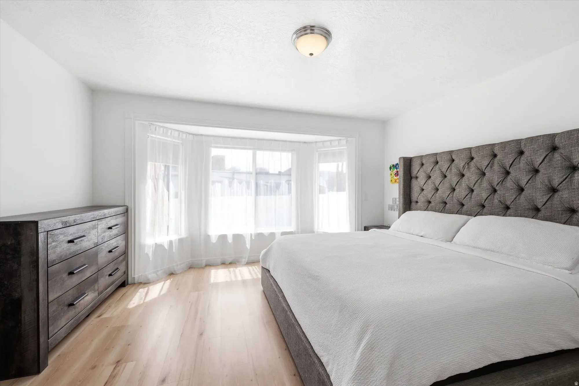 Bedroom with light wood-style flooring
