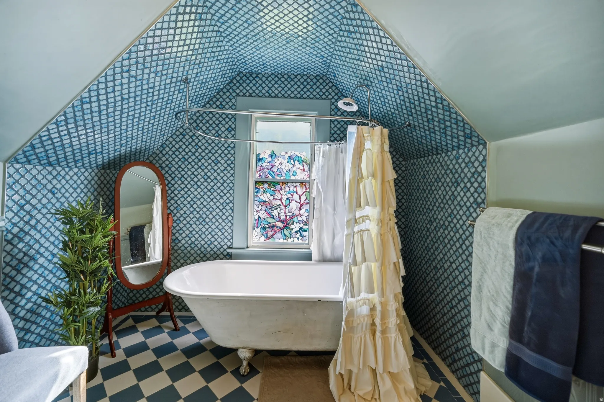 Full bathroom featuring custom tile, clawfoot tub and floor tile imported from England