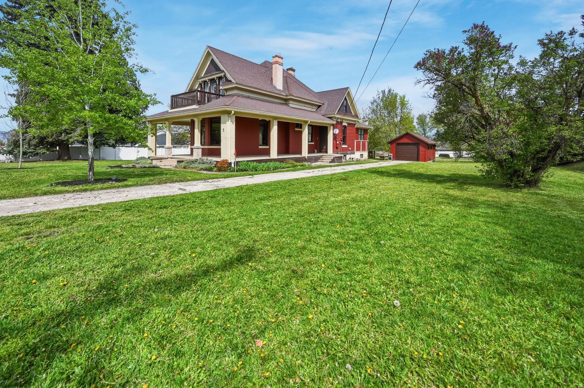 East side view of wrap around porch & garage