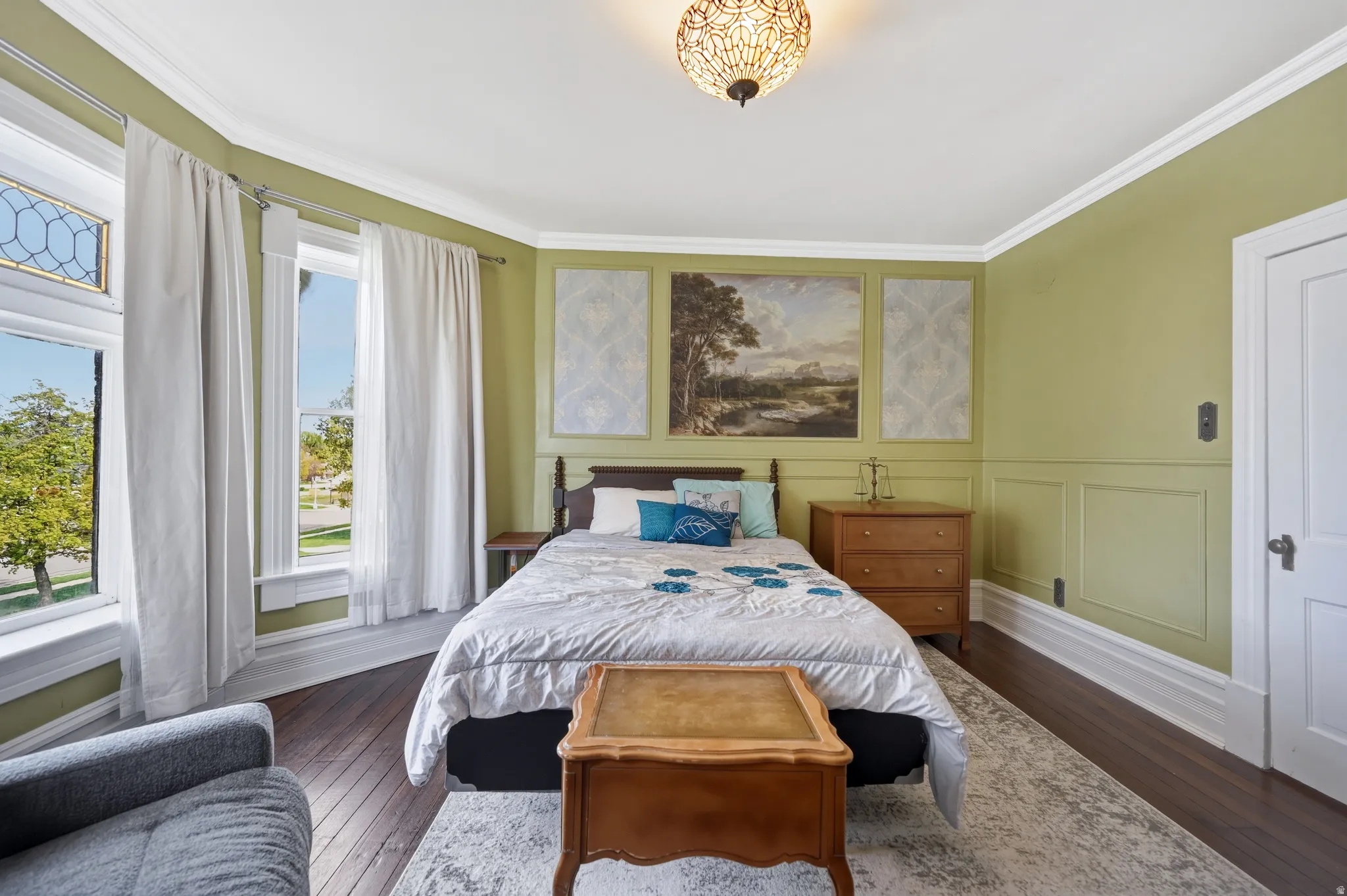 Bedroom with crown molding & bay window