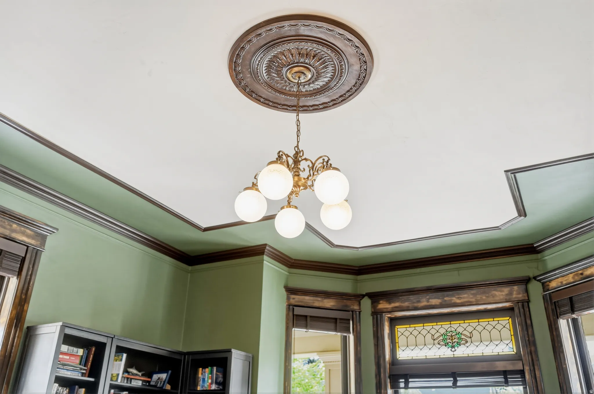 Detailed view of chandelier with ceiling medallion