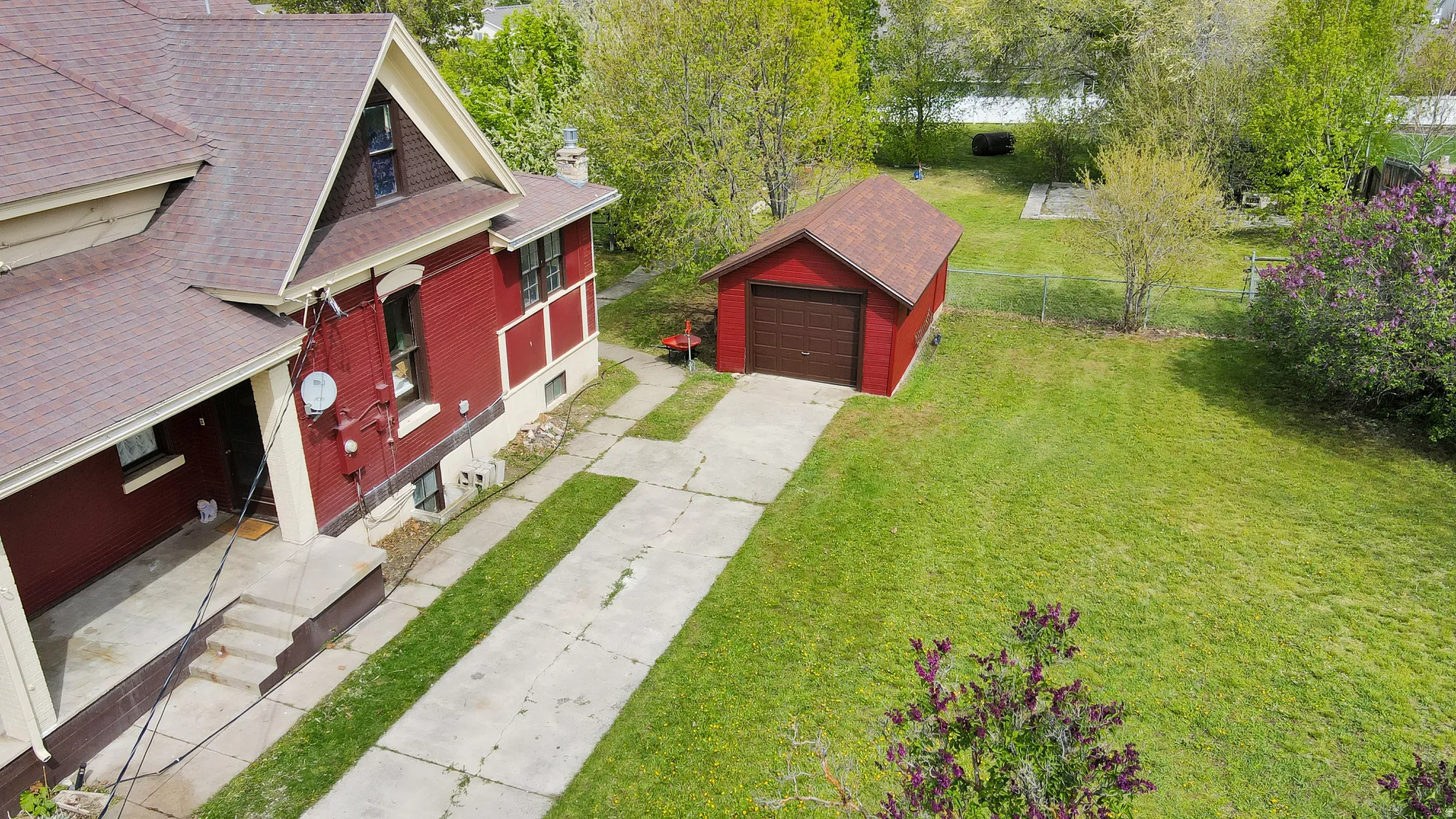 Aerial view of detached garage & side entrance