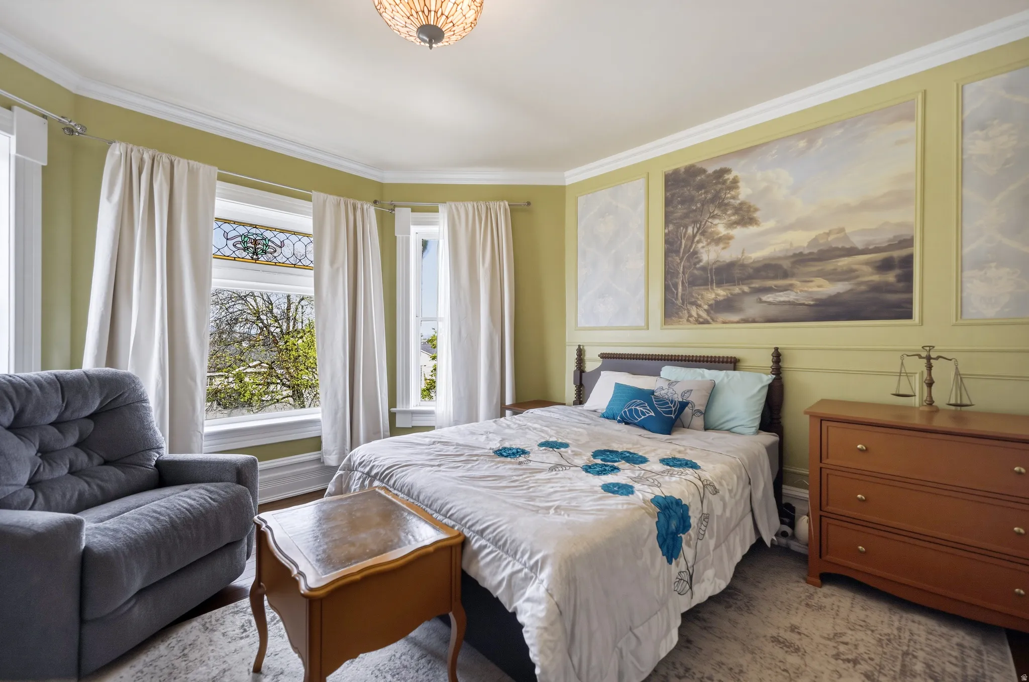 Bedroom with crown molding & bay window