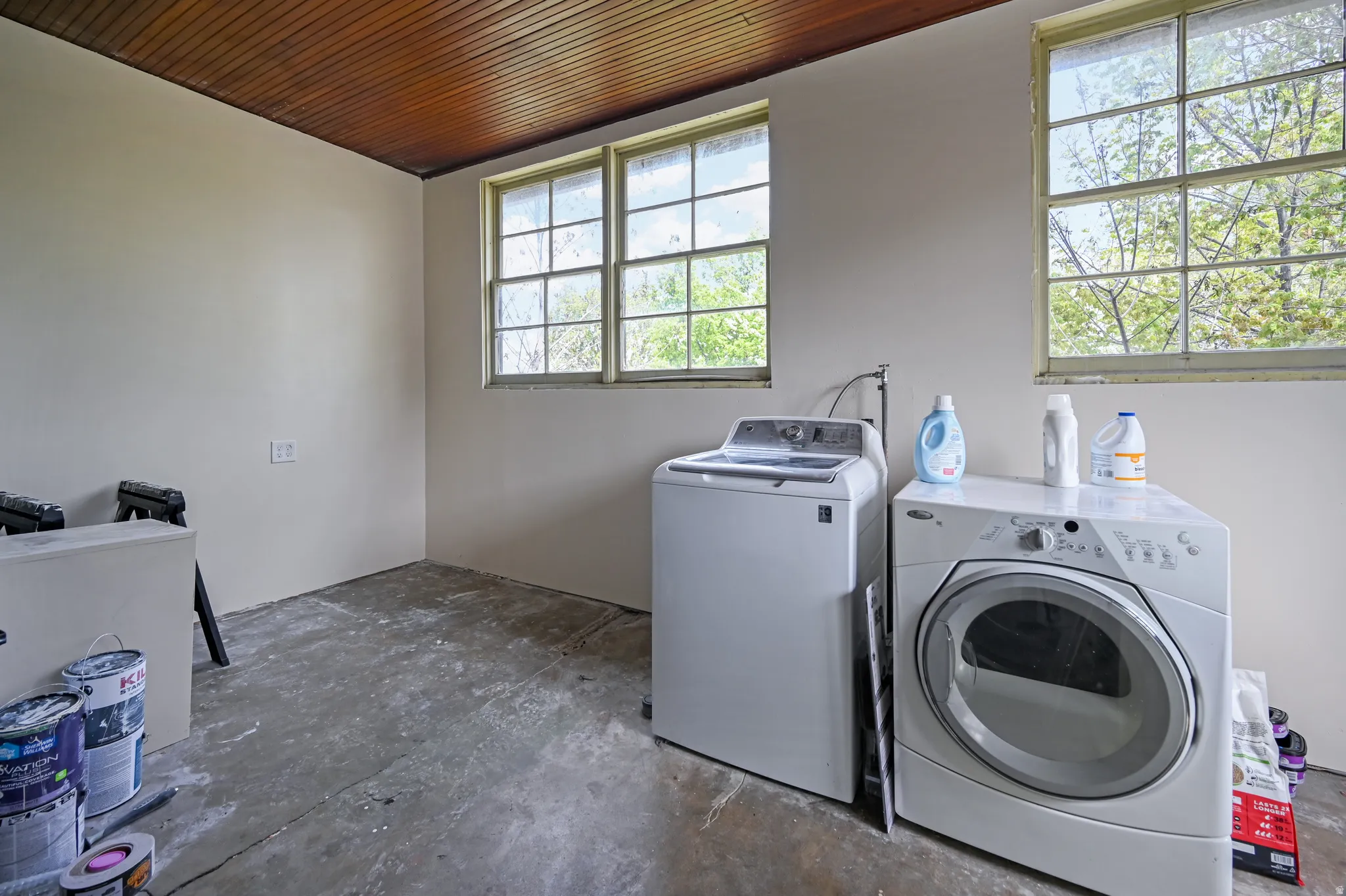 Laundry room located in enclosed back porch