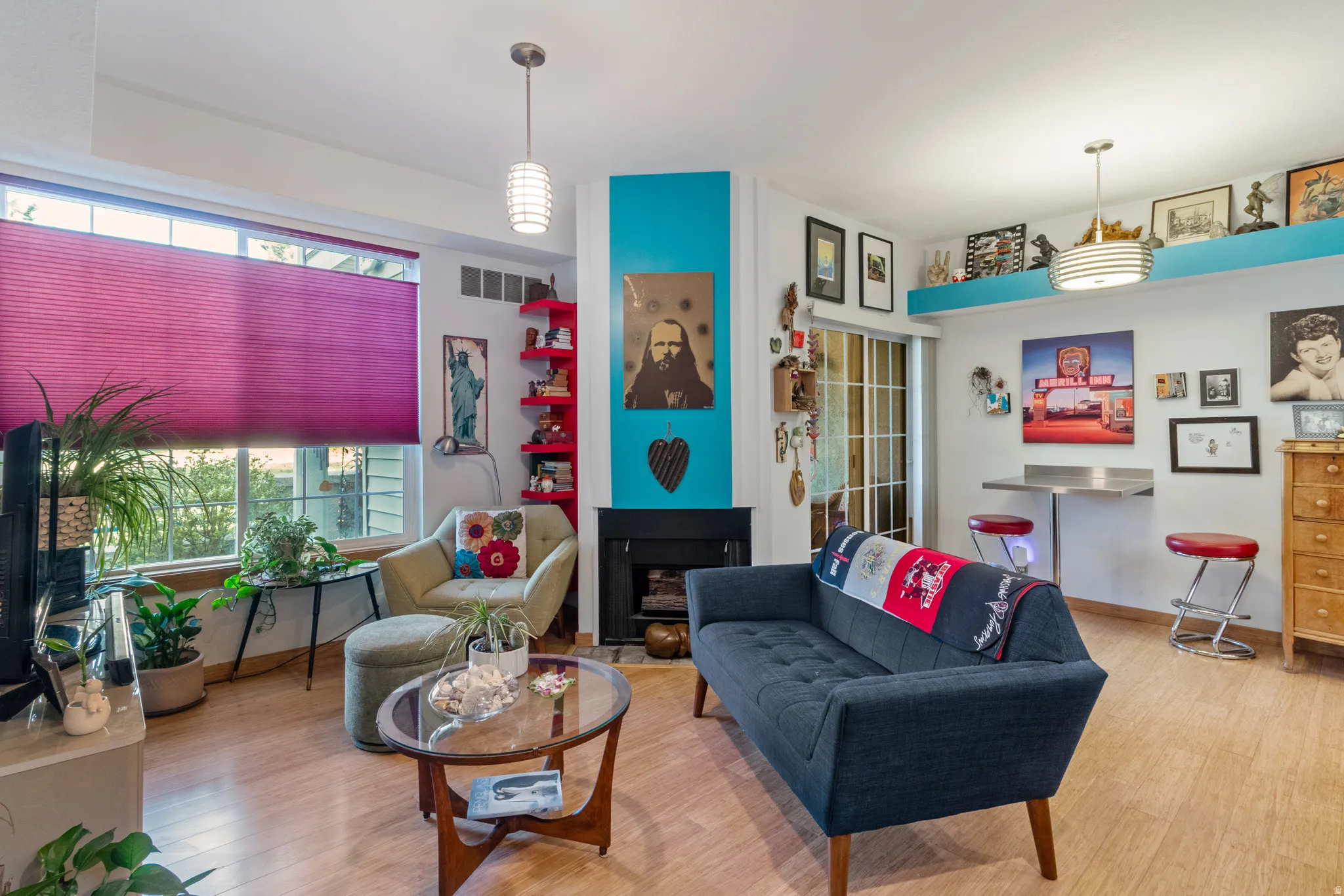 Living room featuring wood finished floors and a fireplace