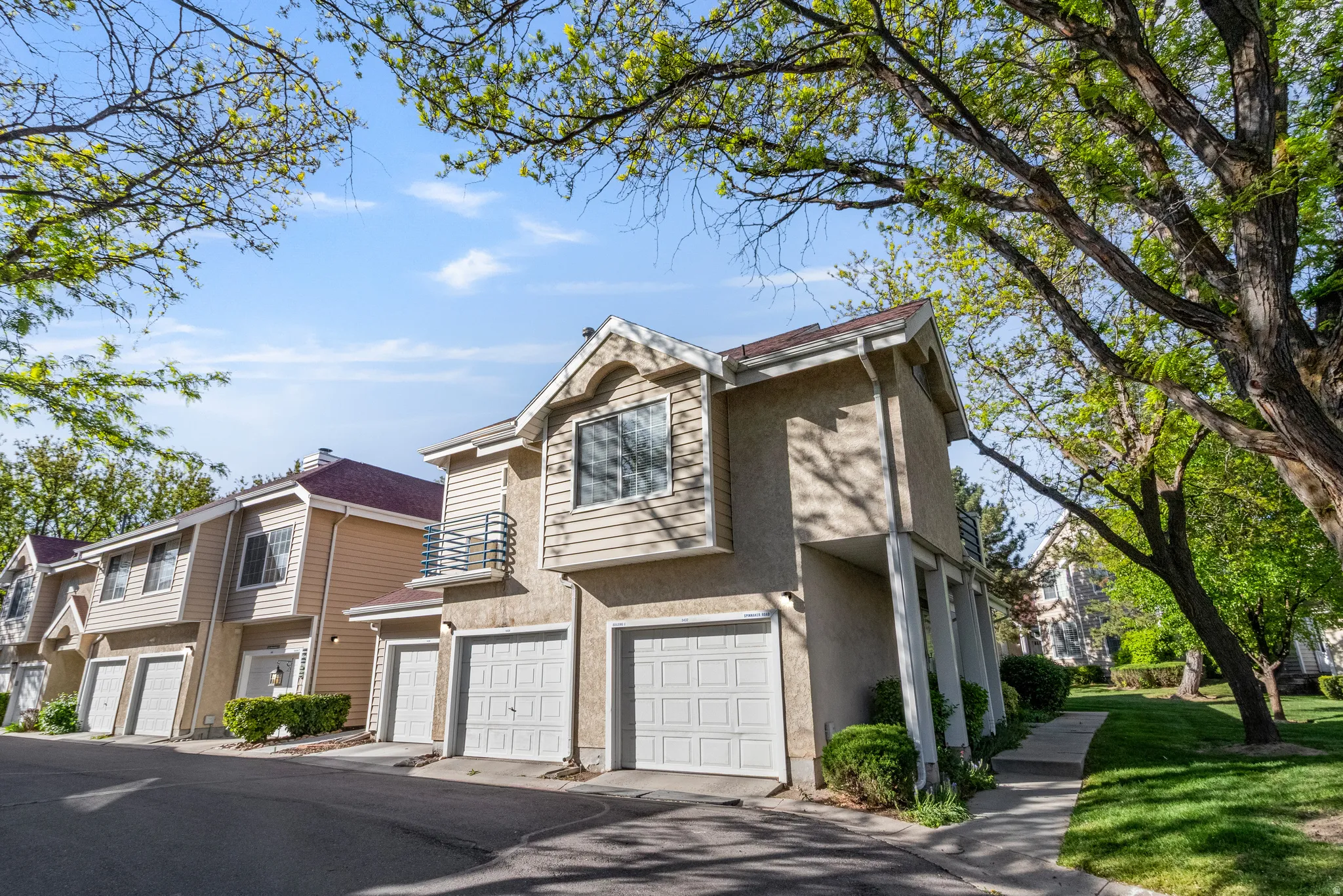 Traditional-style home with a garage and stucco siding
