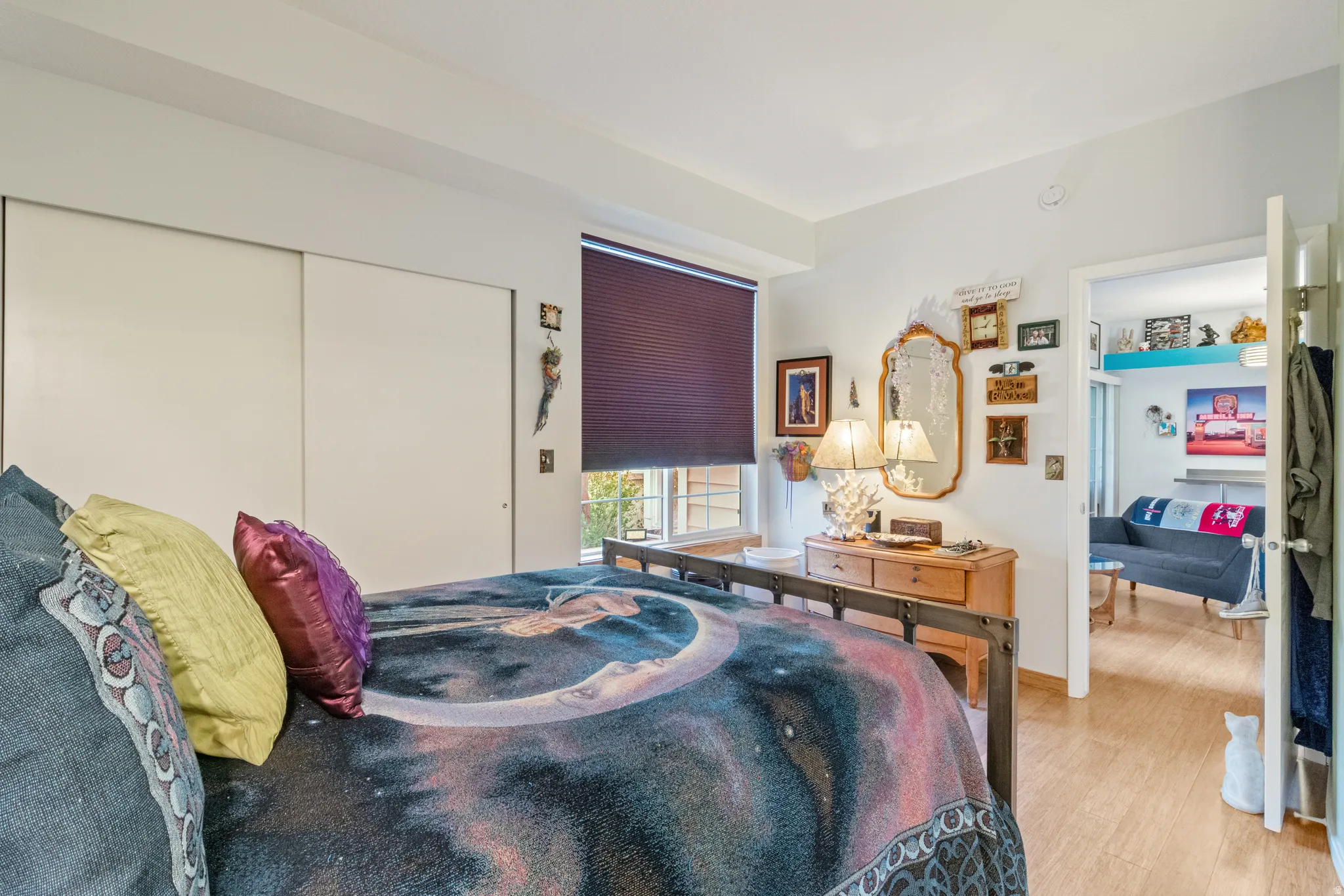 Bedroom with a closet and light wood-style flooring