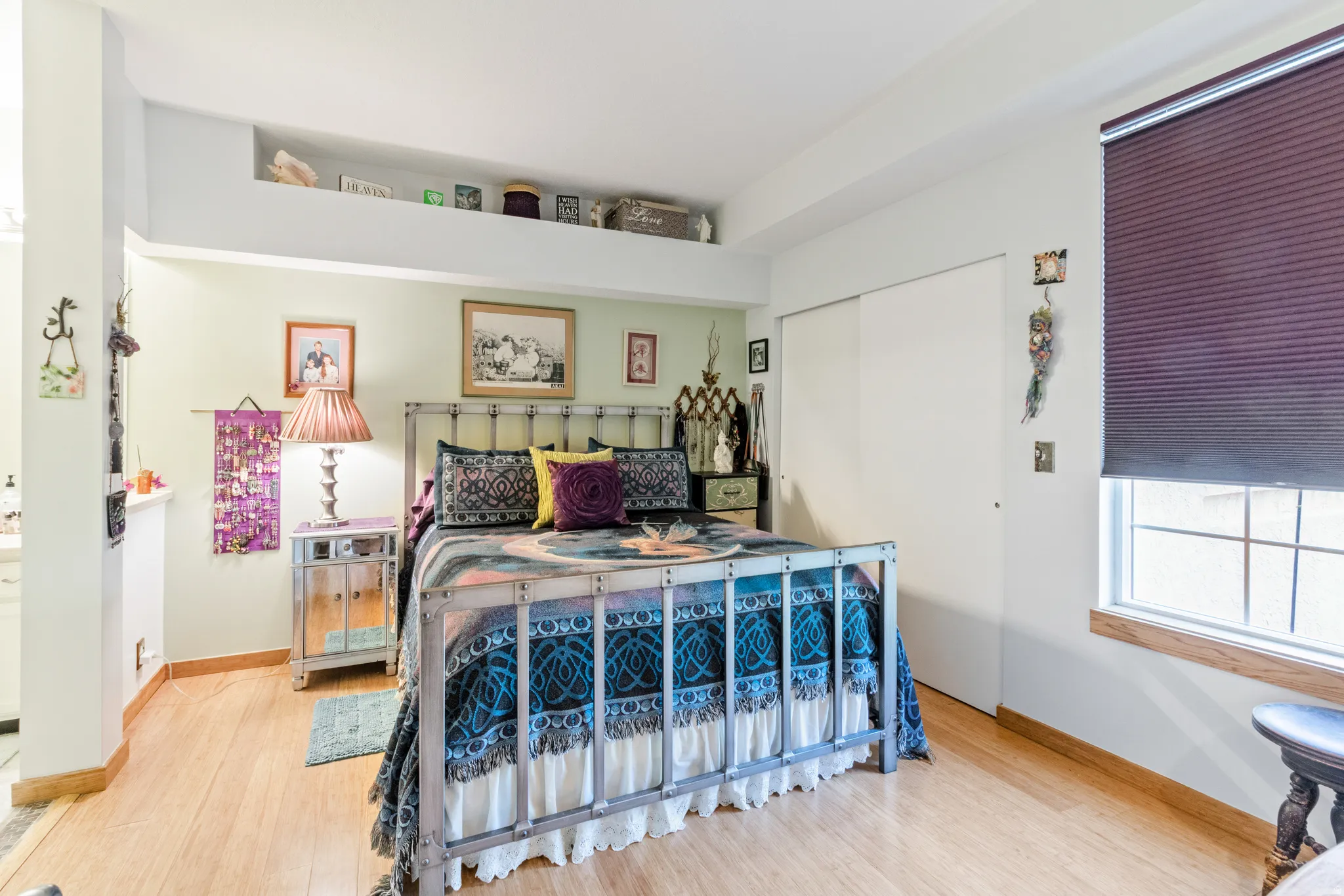 Bedroom featuring a closet and light wood-style floors