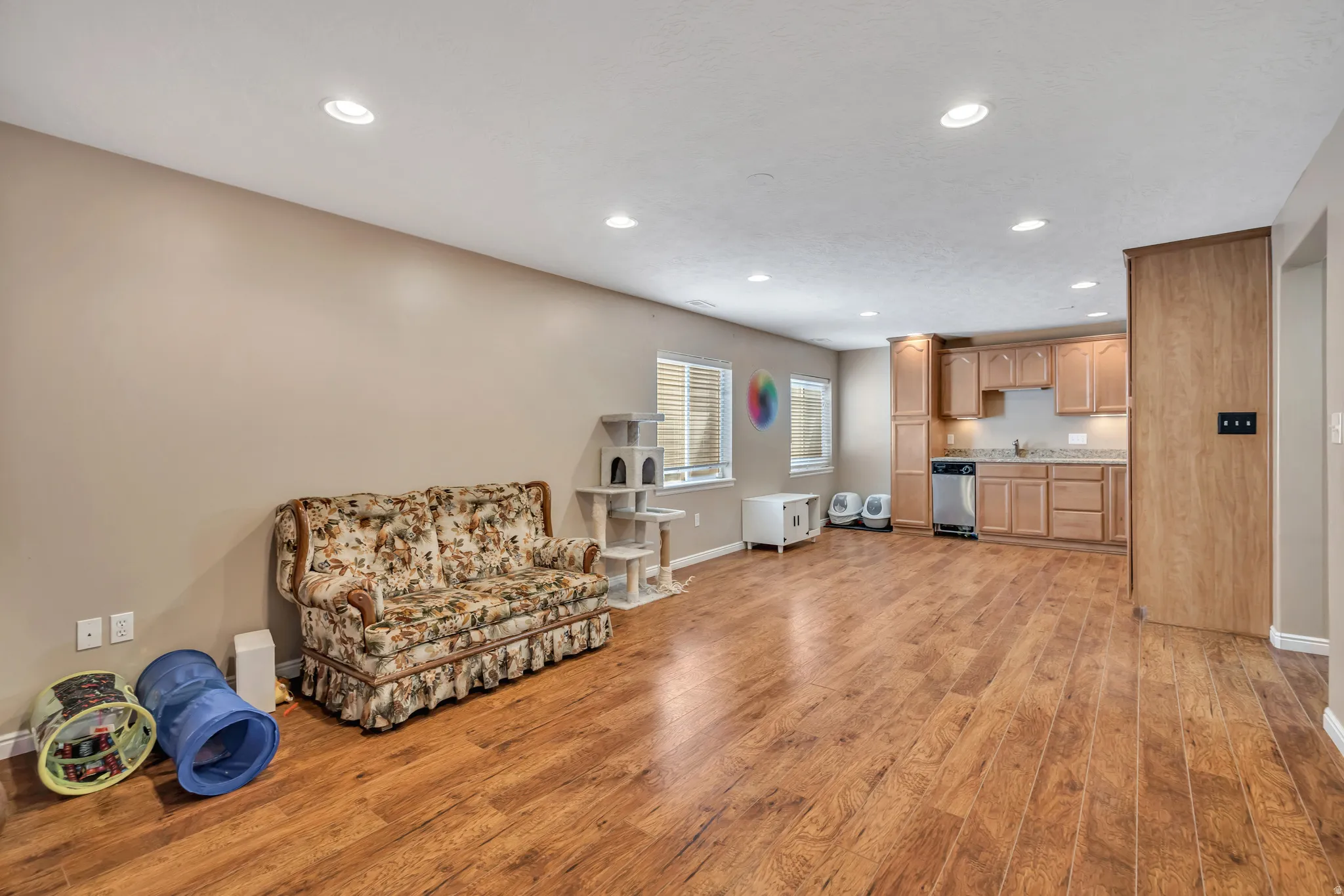 Sitting room featuring light wood-style flooring and recessed lighting