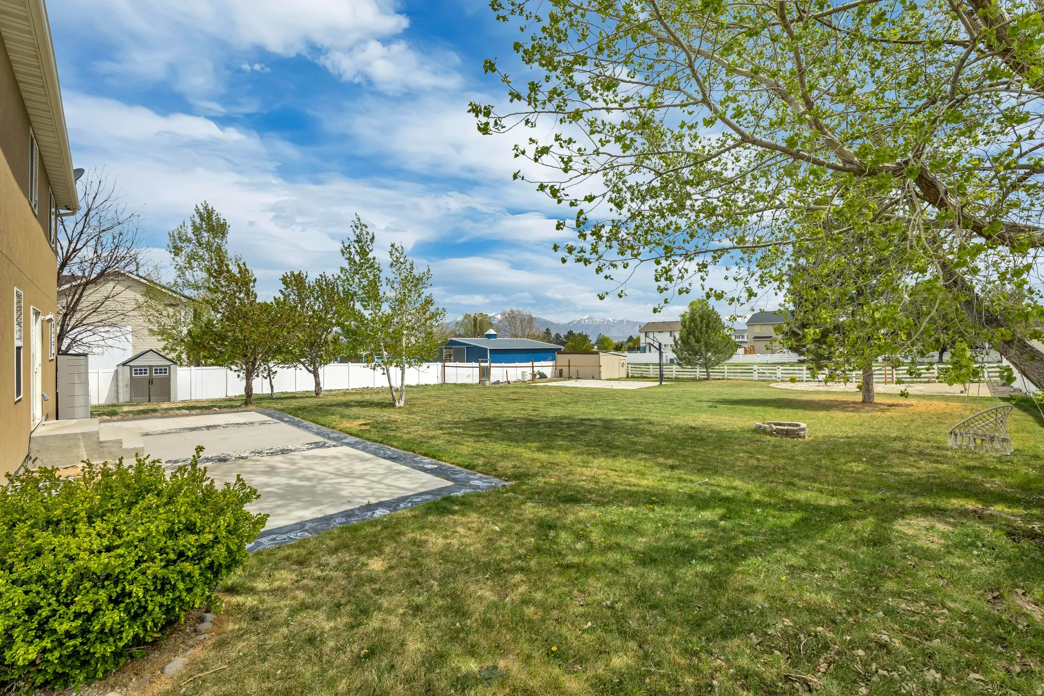 Fenced backyard with a patio