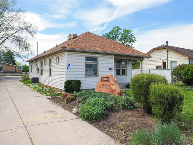 Bungalow featuring a chimney