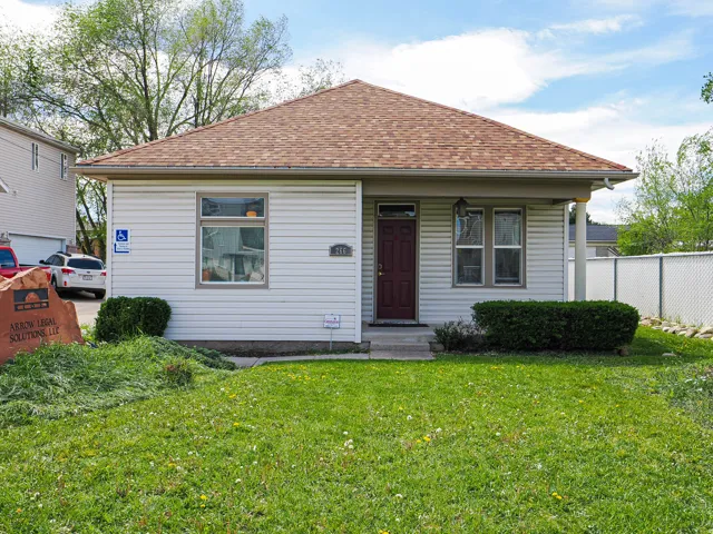 View of front of house with roof with shingles