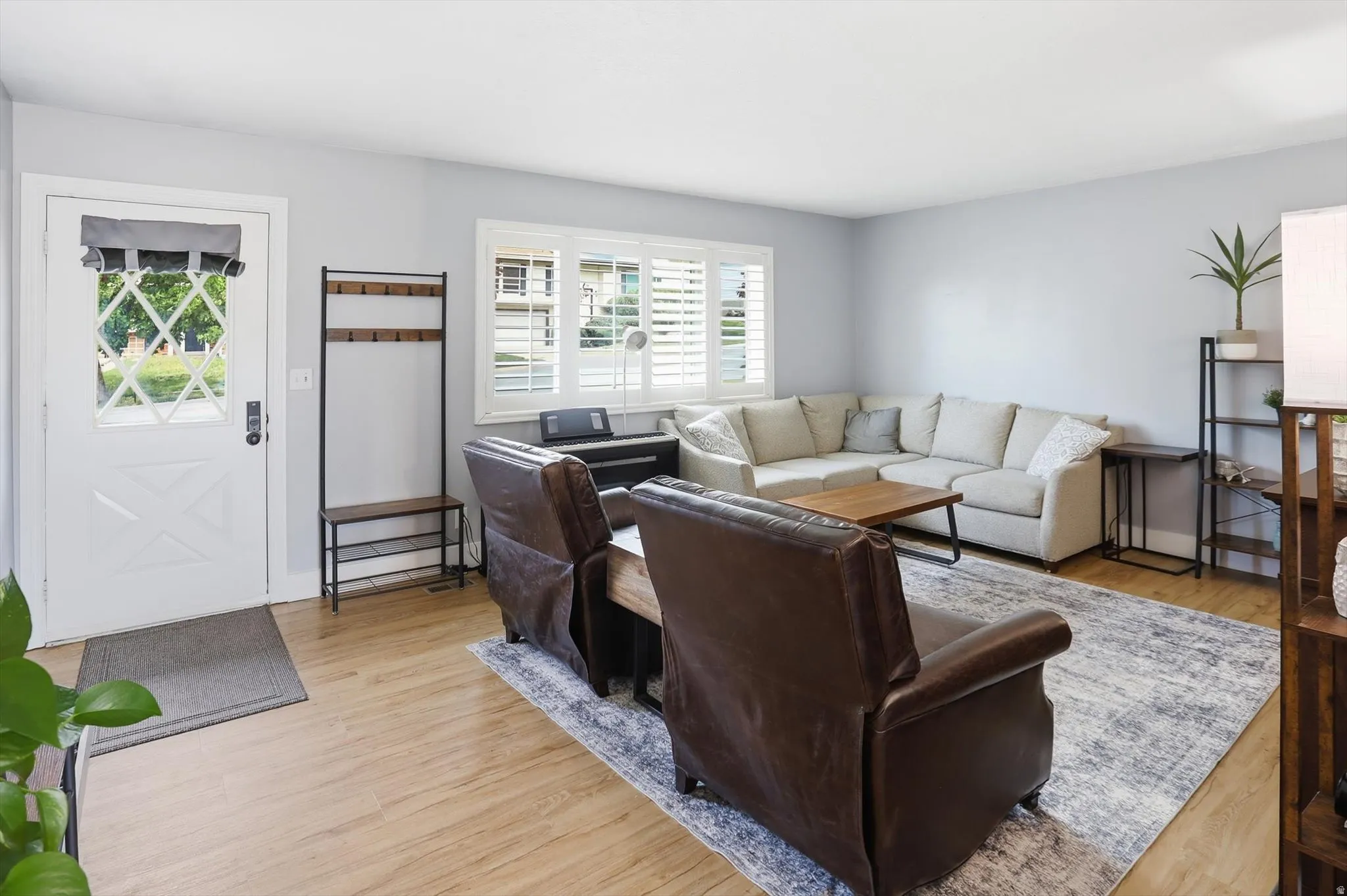 Living area featuring light wood-style floors and plenty of natural light