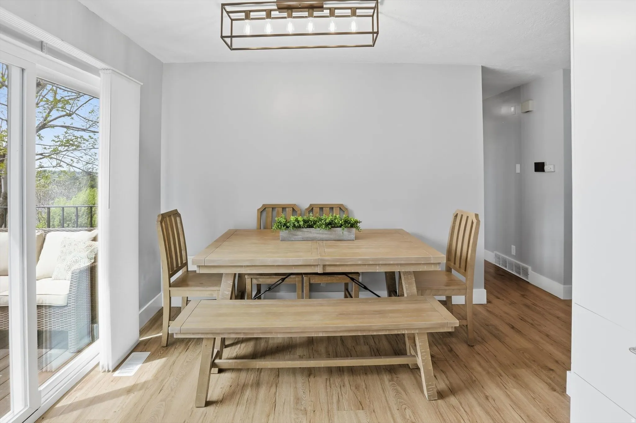 Dining area featuring light wood-style floors