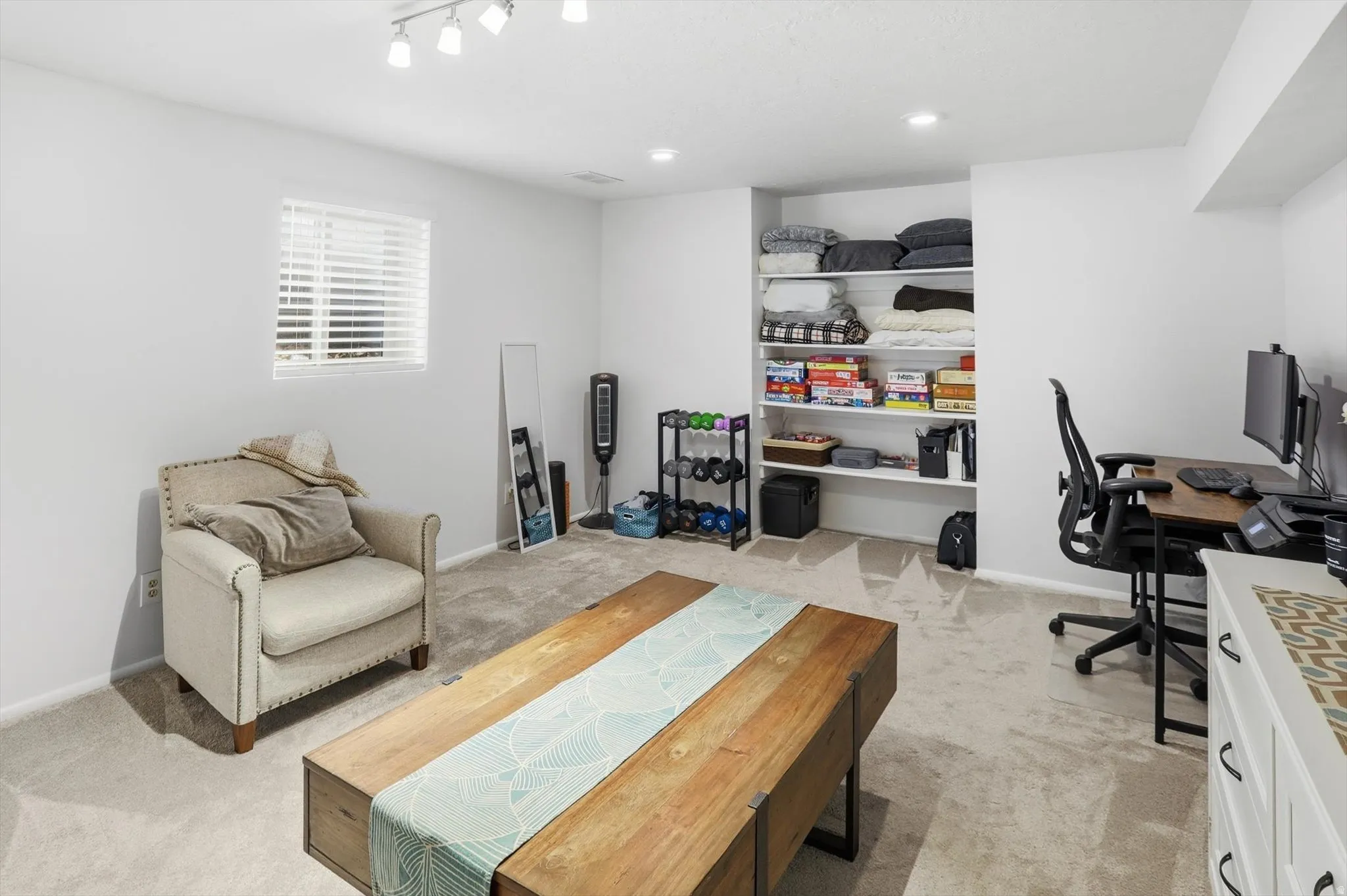 6th Bedroom or Living/Family room featuring light carpet and baseboards