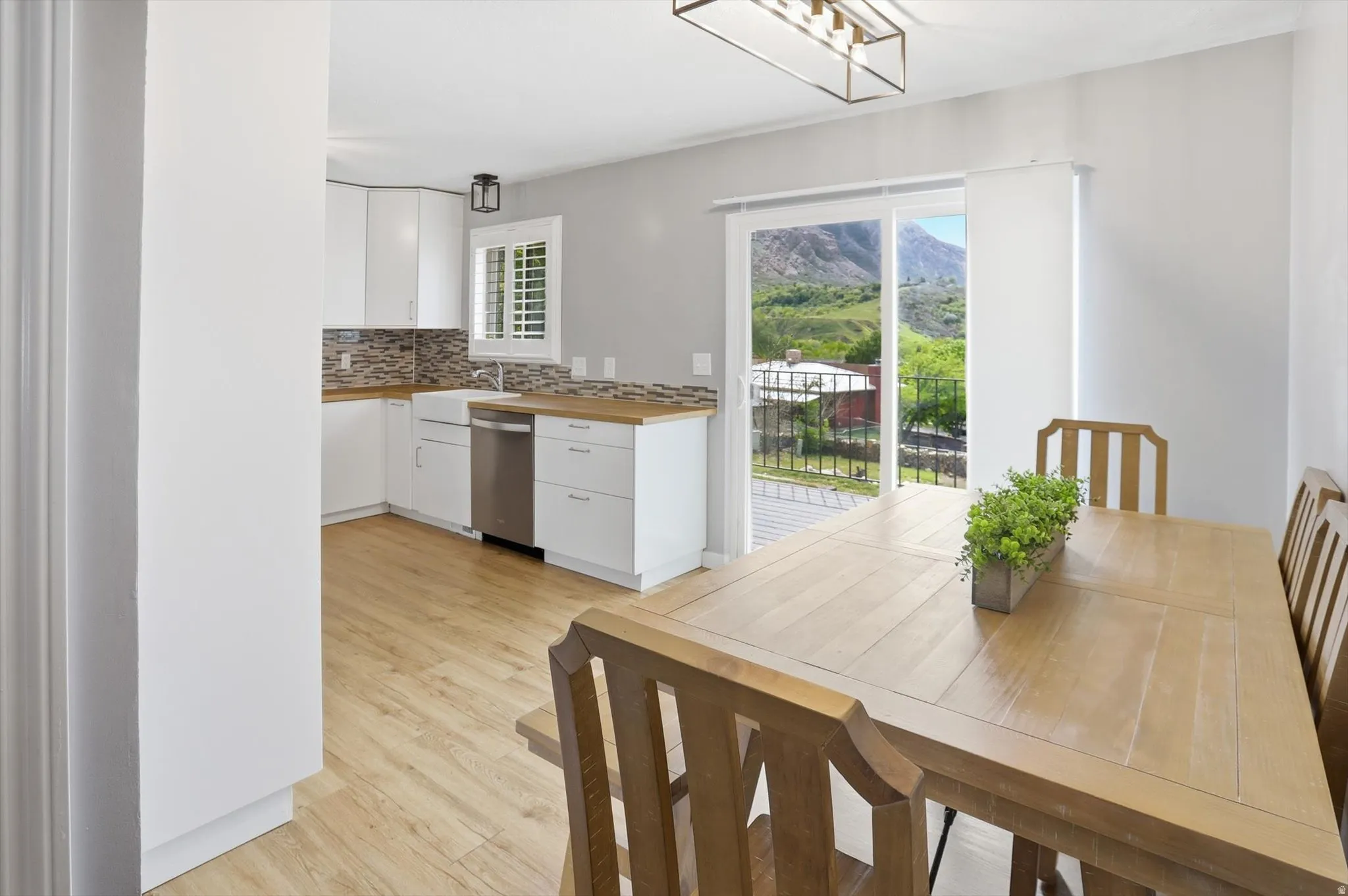 Dining area with light wood-type flooring