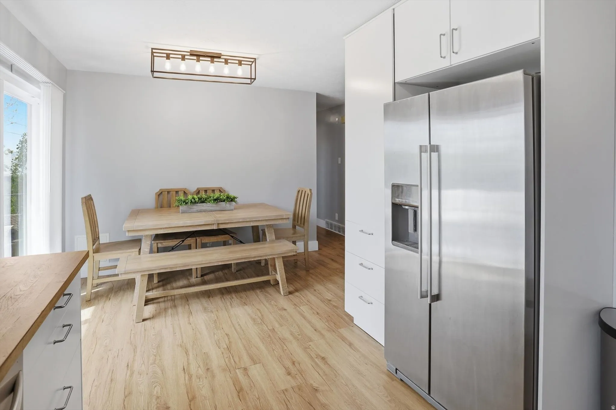 Dining room featuring light wood-style floors