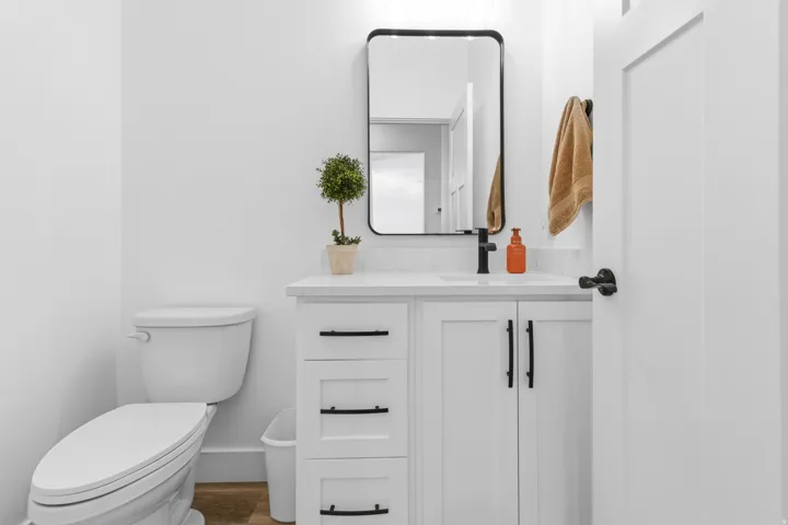 Bathroom with vanity and wood finished floors