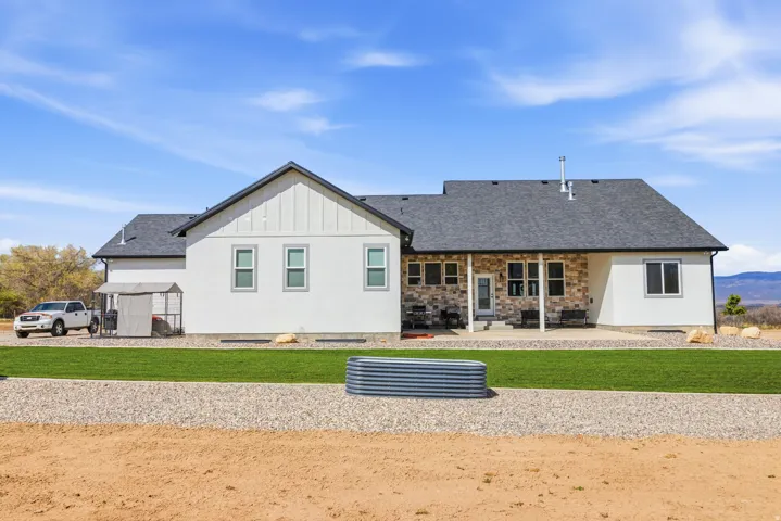 Rear view of property featuring a patio.
