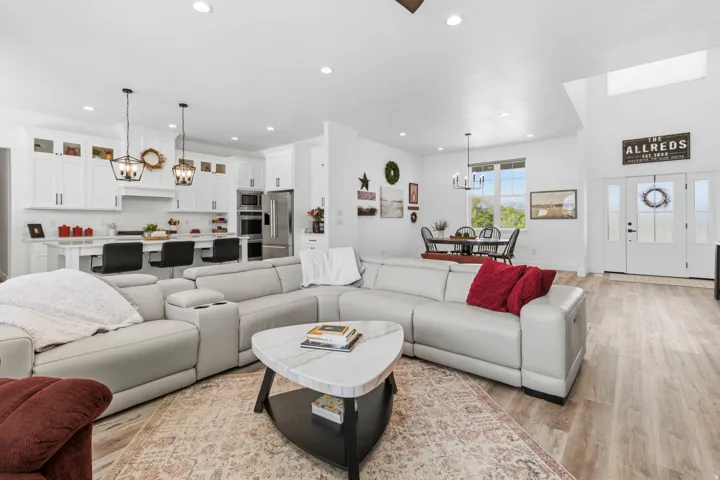 Living room with a chandelier and light wood-style floors